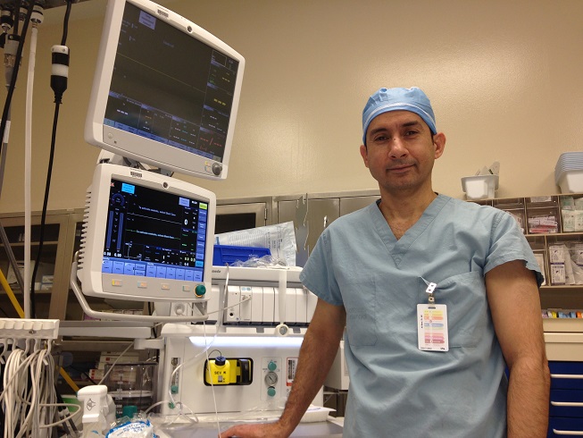 Dr. Al-Beer stands with live-saving anaesthesia machines